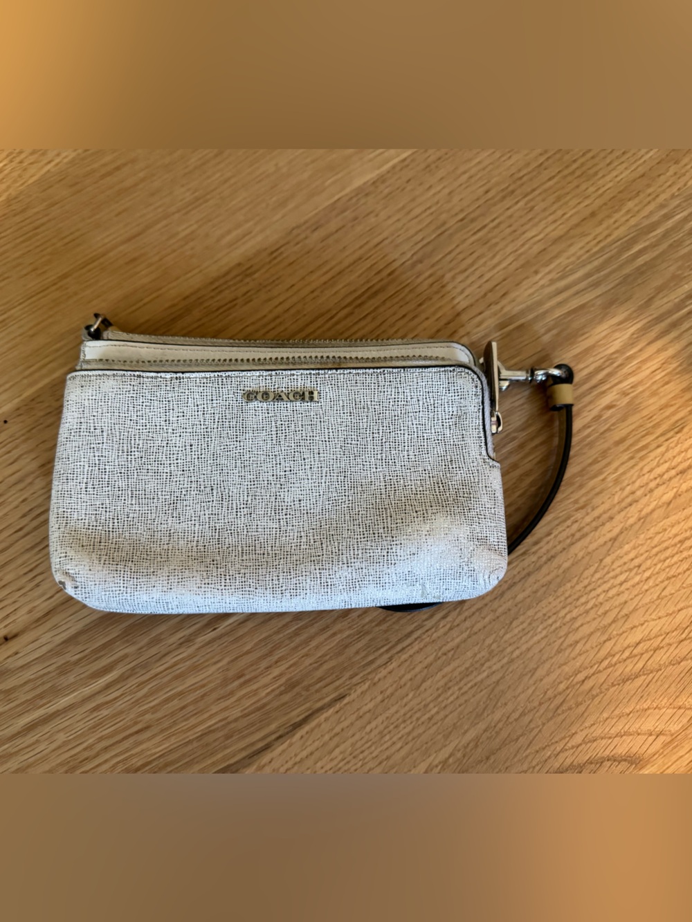 Coach Cream Textured Wristlet with Black Strap